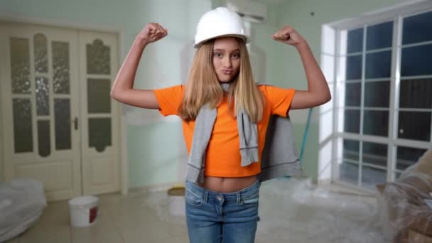 Joyful Teenage Girl Gesturing Strength Looking Camera Standing Living Room — Stock Video