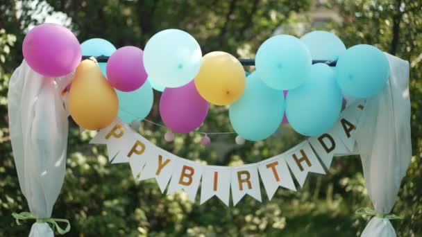 Happy Birthday Sign Colorful Balloons Hanging Outdoors Backyard Holiday Celebration — Stock Video