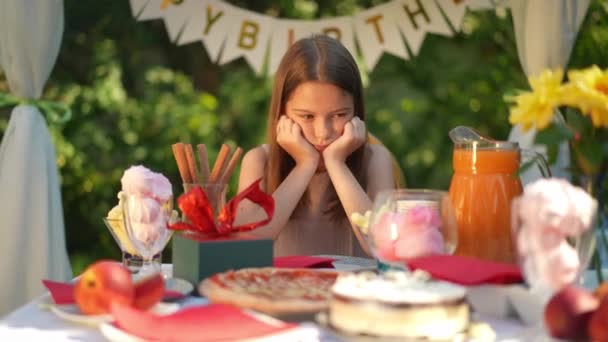 Sad Caucasian Birthday Girl Sitting Table Backyard Alone Sighing Zoom — Stock Video