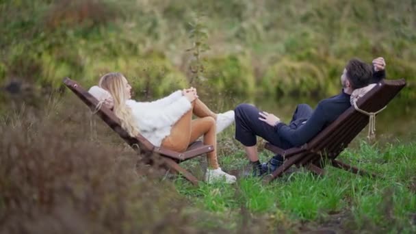 Relaxed Caucasian Man Woman Sitting Wooden Chairs Green Forest Lake — Stock Video