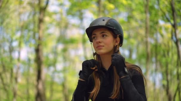 Smiling Young Female Equestrian Fastening Helmet Looking Away Portrait Confident — Stock Video