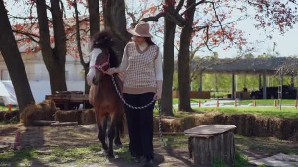 Wide Shot Happy Woman Pony Bridle Walking Smiling Looking Camera — Stock Video