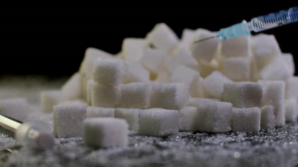 Close Syringe Right Liquid Splashing Pile White Sugar Cubes Closeup — Stock Video