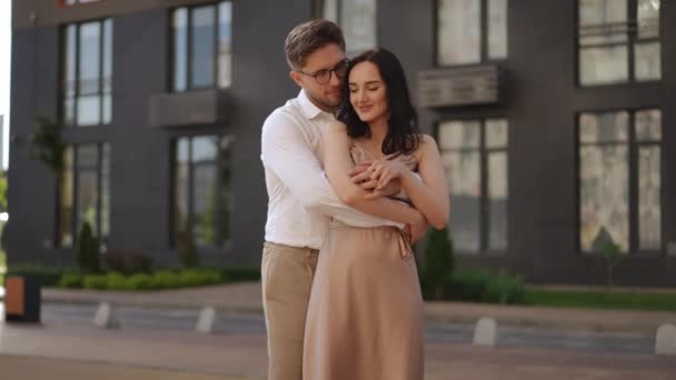 Slow Motion Woman Beautiful Dress Hugs Herself Arms Man Standing — Stock Video