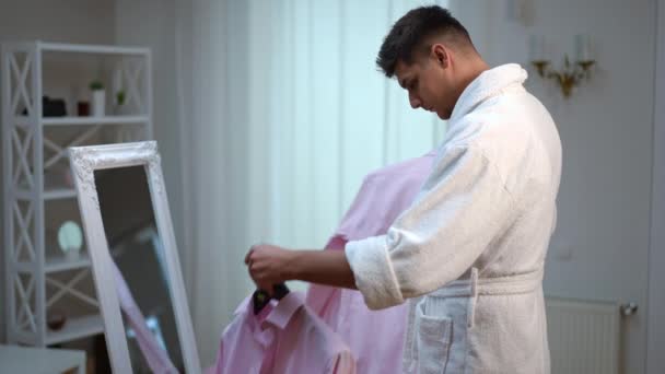 Young Guy White Bathrobe Front Floor Mirror Makes Difficult Choice — Stock Video