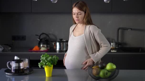 Pregnant Woman Thinking What Eat While Standing Modern Kitchen Her — Stock Video