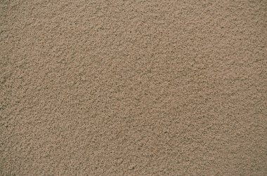 Kumlu kahverengi desenli bir yüzeyin tam kare makro görüntüsü, arka plan veya soyut kavramlar için uygun