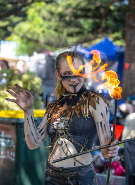 South Australia, Victor Harbor, Viking Festival: Fire performer showcasing skills with flame, participant of the local festival, a costume performance at a community event clipart