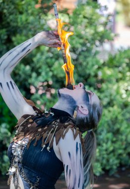 South Australia, Victor Harbor, Viking Festival: Fire performer showcasing skills with flame, participant of the local festival, a costume performance at a community event clipart