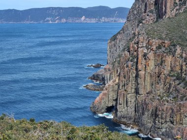 pectacular cliffs of Cape Hauy Tasmania overlooking the ocean, a highlight of the rugged coastal hike, Australia. High quality photo clipart