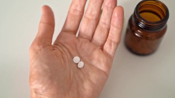 Woman Holding Some Pills Her Palm Slowly Unfolding Fingers Brown — Stok Video