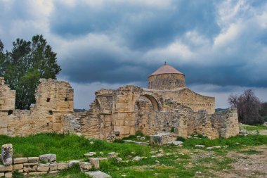 Ruins of the 14th-century monastery of Timios Stavros or Holy Cross Monastery in Anogyra, Lemesos (Limassol), Cyprus, under a dark sky clipart