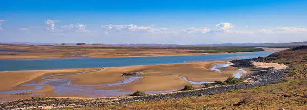 stock image Panorama of vast mudflats with channels at the remote Butcher Inlet, at the mouth of the Harding River, near Cossack in the Pilbara region of Western Australia