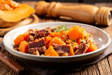 Dried meat with pumpkin. Tipical brazilian dish. clipart