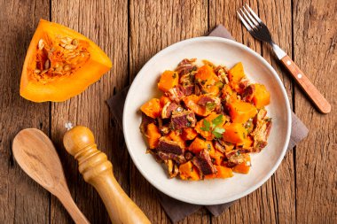 Dried meat with pumpkin. Tipical brazilian dish. clipart
