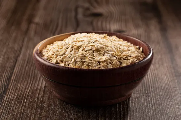 Oat Flakes Wooden Bowl — Stock Photo, Image
