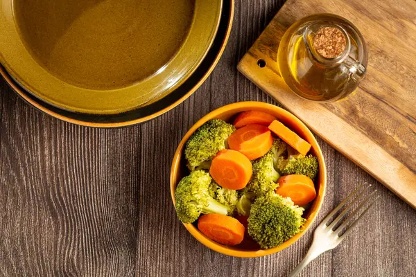Bowl with broccoli and carrot salad.