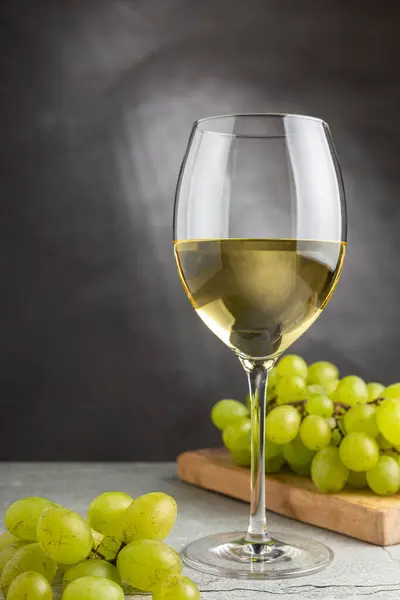 stock image Glass of white wine on the table.