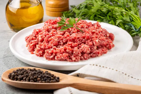 Raw ground beef ready for preparation.
