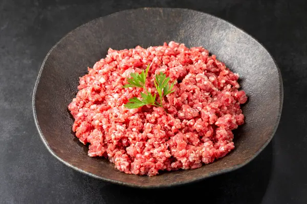 Raw ground beef ready for preparation.