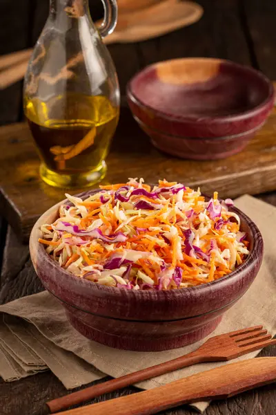 Coleslaw salad with white cabbage, red cabbage and sliced carrots