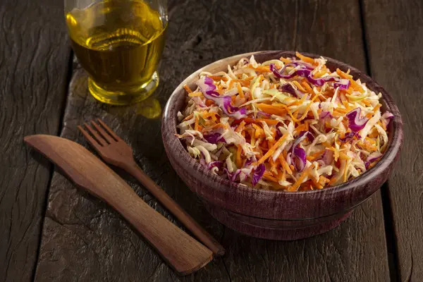 Coleslaw salad with white cabbage, red cabbage and sliced carrots