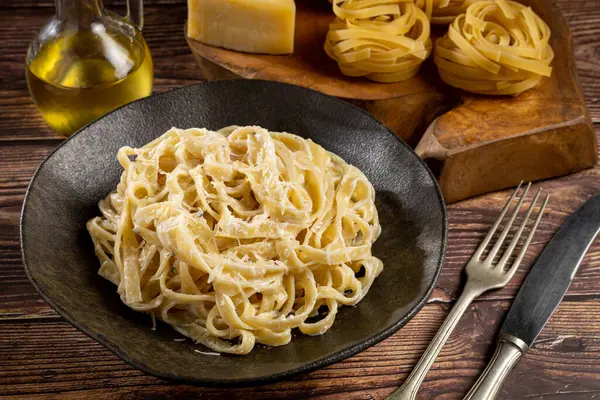 Delicious fettuccine pasta with white cheese sauce. Fettuccine pasta with Alfredo sauce.