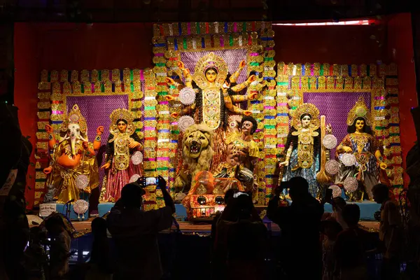 Stock image Kolkata, India - 20 October 2024: Pandals with recreations of the goddess Durga are seen in the city center during Durga Puja celebrations, an annual festival celebrating Hindu goddess Durga.