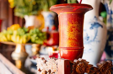 Traditional vietnamese decoration inside a folk religion temple in Ninh Binh. Close up of gifts and art inside a pagoda in Vietnam clipart