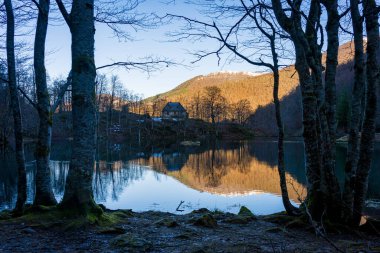 Bethmale lake landscape during winter. Small lake in the Pyrenees mountains clipart