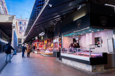 Barcelona, Spain - 20 January 2025: people and tourists are seen in the landmark Mercat de Sant Josep de la Boqueria, a famous historic market and tourist attraction in the city center clipart