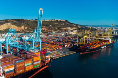 Barcelona, Spain- 5 February 2025: Aerial view of shipping containers and cargo ships in the sea port of Barcelona in Spain, Europe. Concept of sea and maritime trade and trade war due to tariffs. clipart