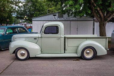 Des Moines, IA - July 01, 2022: High perspective side view of a 1941 Ford Half Ton Pickup Truck at a local car show. clipart