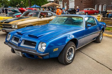 Des Moines, IA - July 01, 2022: High perspective front corner view of a 1974 Pontiac Firebird Formula 400 Coupe at a local car show. clipart