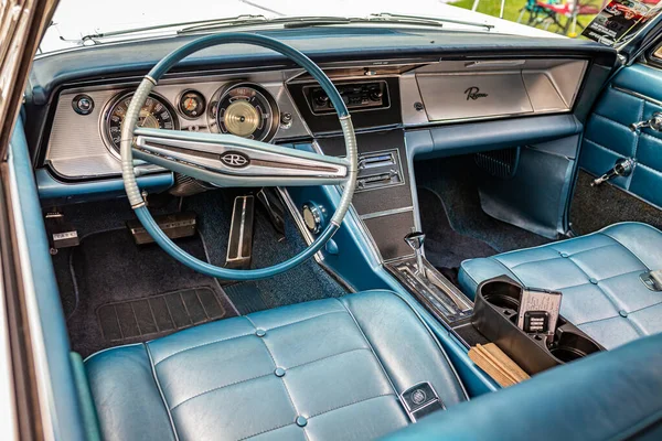 stock image Des Moines, IA - July 01, 2022: HIgh perspective detail interior view of a 1964 Buick Riviera 2 Door Hardtop at a local car show.