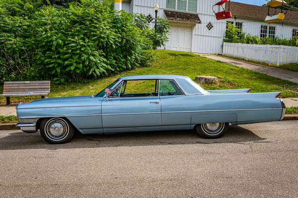 Des Moines, IA - July 02, 2022: High perspective side view of a 1964 Cadillac Coupe DeVille at a local car show.
