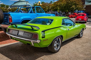 Des Moines, IA - July 03, 2022: High perspective rear corner view of a 1970 Plymouth Hemi Cuda Hardtop Coupe at a local car show. clipart