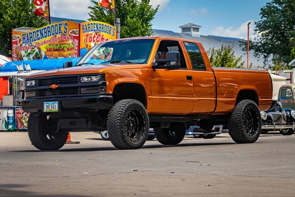 stock image Des Moines, IA - July 03, 2022: Wide angle front corner view of a 1998 Chevrolet K1500 Pickup at a local car show