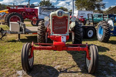 Fort Meade, FL - February 24, 2022: High perspective front view of a 1956 Ford Powermaster Model 960 Row Crop Tractor at a local tractor show.