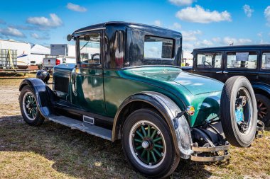 Fort Meade, FL - February 24, 2022: Low perspective rear corner view of a 1927 Hupmobile Series A Sport Coupe at a local car show.