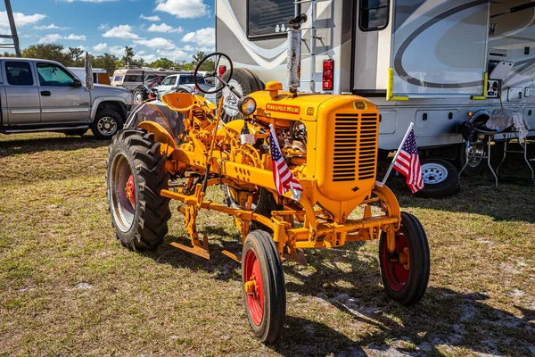 Fort Meade, FL - February 24, 2022: High perspective front corner view of a 1952 Minneapolis-Moline BF Avery Tractor at a local tractor show.