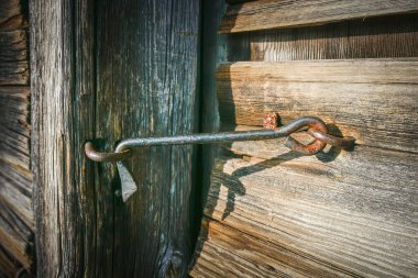 The lock system of the old door. Made by a blacksmith. The old Huhtala museum farm. The farm was established in the 1700s. Isojaervi National Park in Finland.