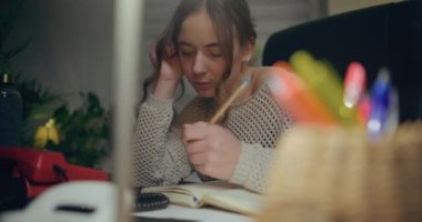 Portrait of Pensive Woman Working Late at Home Office. Contemplative Thoughtful Woman.