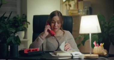 Portrait of Pensive Woman Working Late at Home Office. Contemplative Thoughtful Woman.