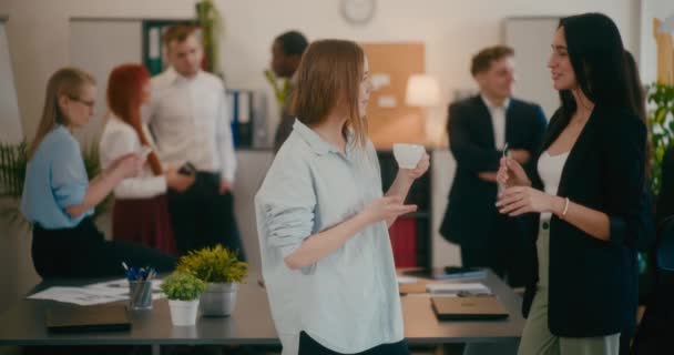 Female Colleagues Discussing While Having Coffee Break Office — Stock Video