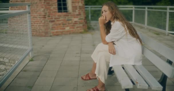 Slow Motion Shot Depressed Young Woman Hand Chin Sitting Bench — Stock Video