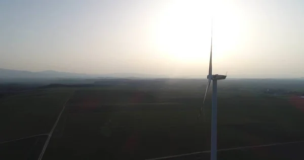 Windmill and Wind power technology background. Aerial view on Wind Power, Turbine, Windmill, Energy Production - Green technology. Renewable energy solution