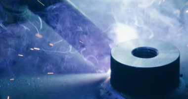 Close Up Of Bright Welding Sparks Welding Metal Parts At Steel Construction Industrial Workshop