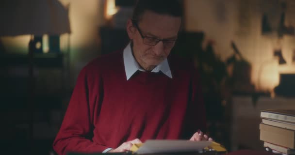 Senior Man Typing Vintage Typewriter Pensively Crafting His Book Quiet — Stock Video