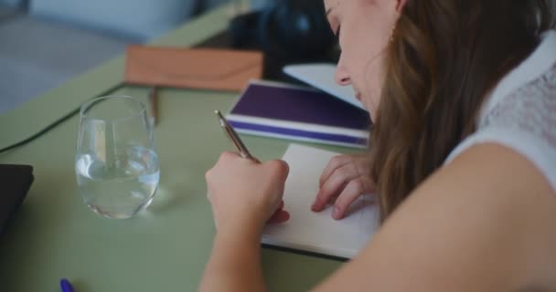Woman Engaged Online Learning Jotting Notes Her Notebook — 비디오